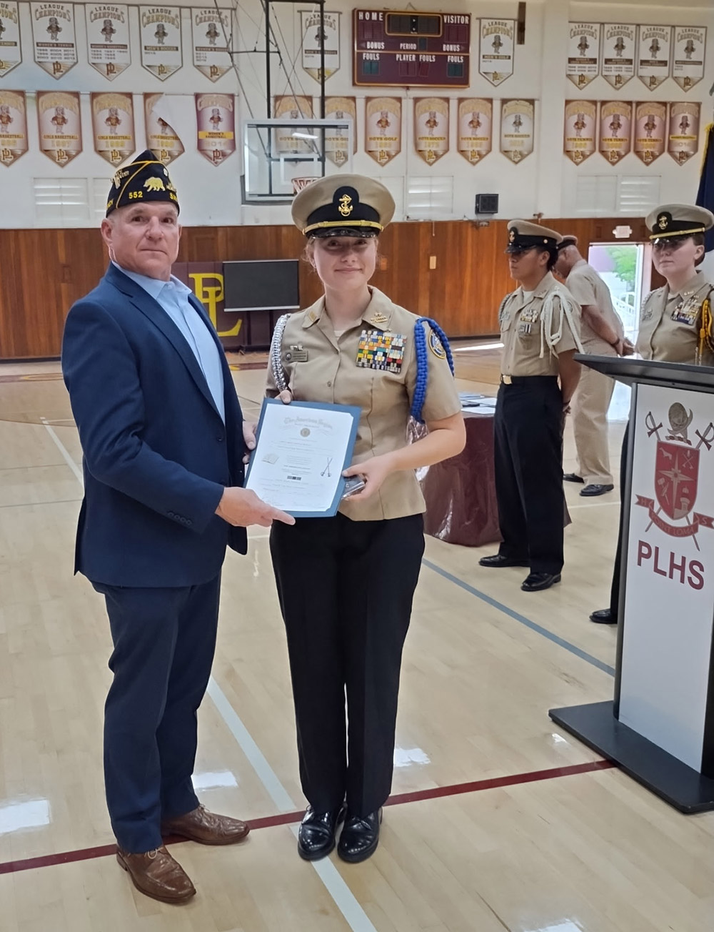 Post member Brian Compton and Cadet Captain Addison Bullard